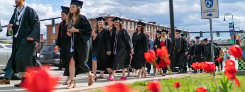 UNH Manchester students taking a "selfie'' at the 2015 commencement ceremony